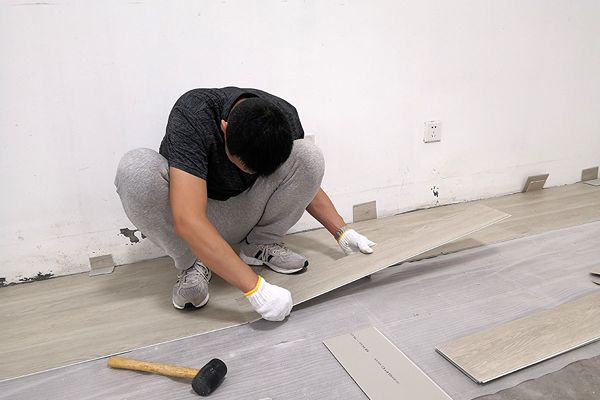 Floorstore Expert Installing SPC Flooring in Dubai Home